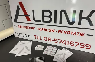 Reclamebord en stickers voor Albink